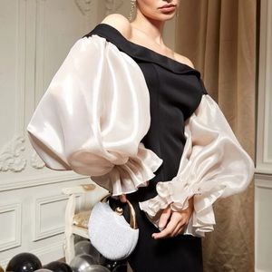 Black off-the shoulder dramatic sleeve gown